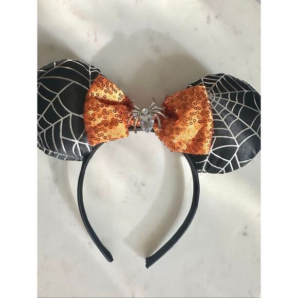 Disney’s Minnie mouse spiderweb and sequin orange bow ears